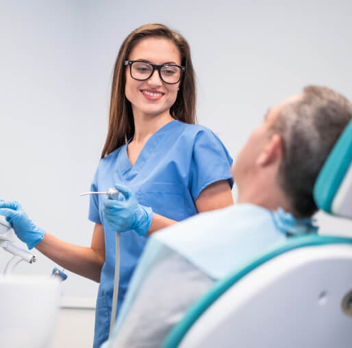 dental assistant with patient